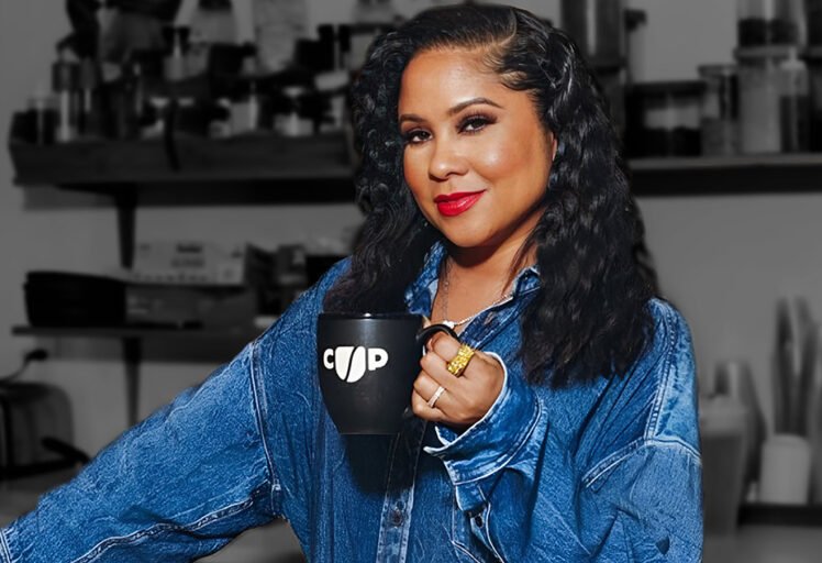 Angela Yee holding a Coffee Uplifts People mug, representing Channing & Company’s brand strategy and culture-led marketing work for CUP.