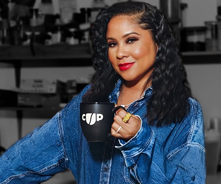 Angela Yee holding a Coffee Uplifts People mug, representing Channing & Company’s brand strategy and culture-led marketing work for CUP.