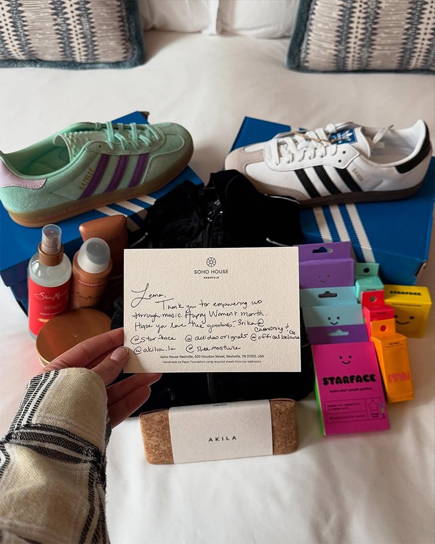 Adidas Originals sneakers, Starface products, SheaMoisture products, and an AKILA eyewear case arranged for Women in Music speaker gift bags at Soho House Nashville.