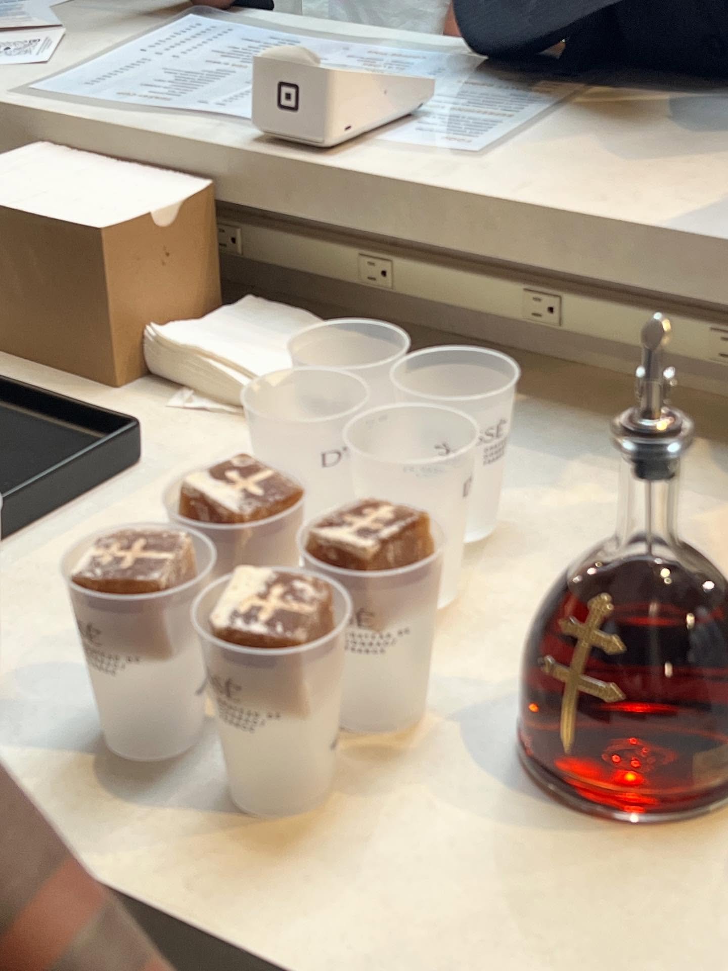 D’USSÉ XO bottle beside Café Con Leche coffee cubes prepared for sampling at the CUP x Daily Paper Paper CUP Friday event in New York.